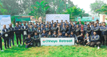 Large group photo of team members at an outdoor retreat, representing Chhaya’s growing team and community-focused mission.